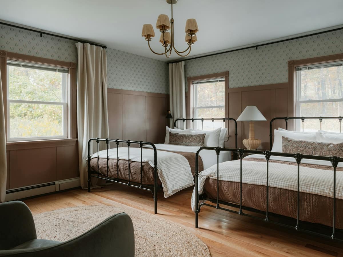 The Twin Room: two single iron beds with white bedding